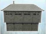Edificio rectangular de ladrillo de dos plantas con tejado de pizarra y wo-4