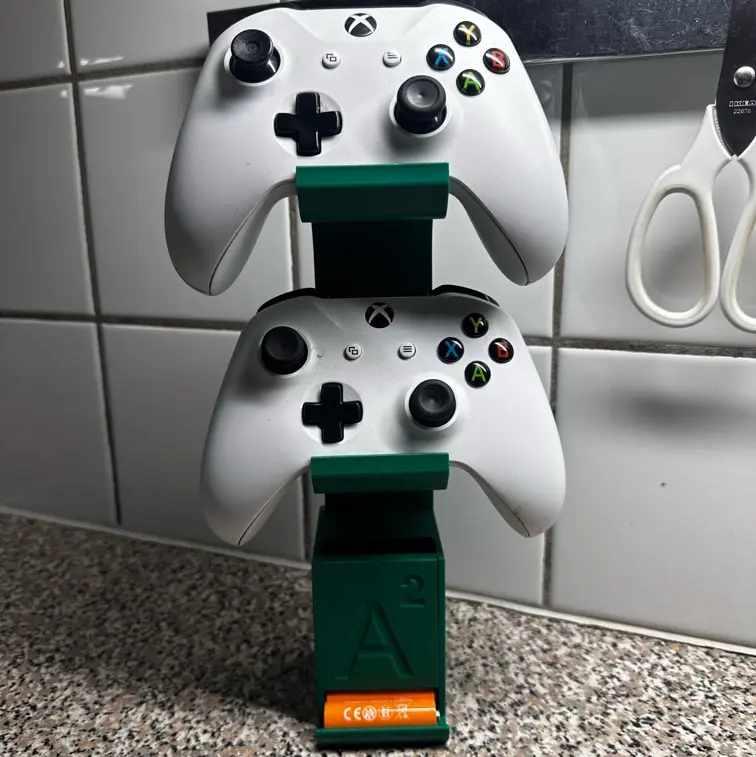 Controller stand with battery dispenser