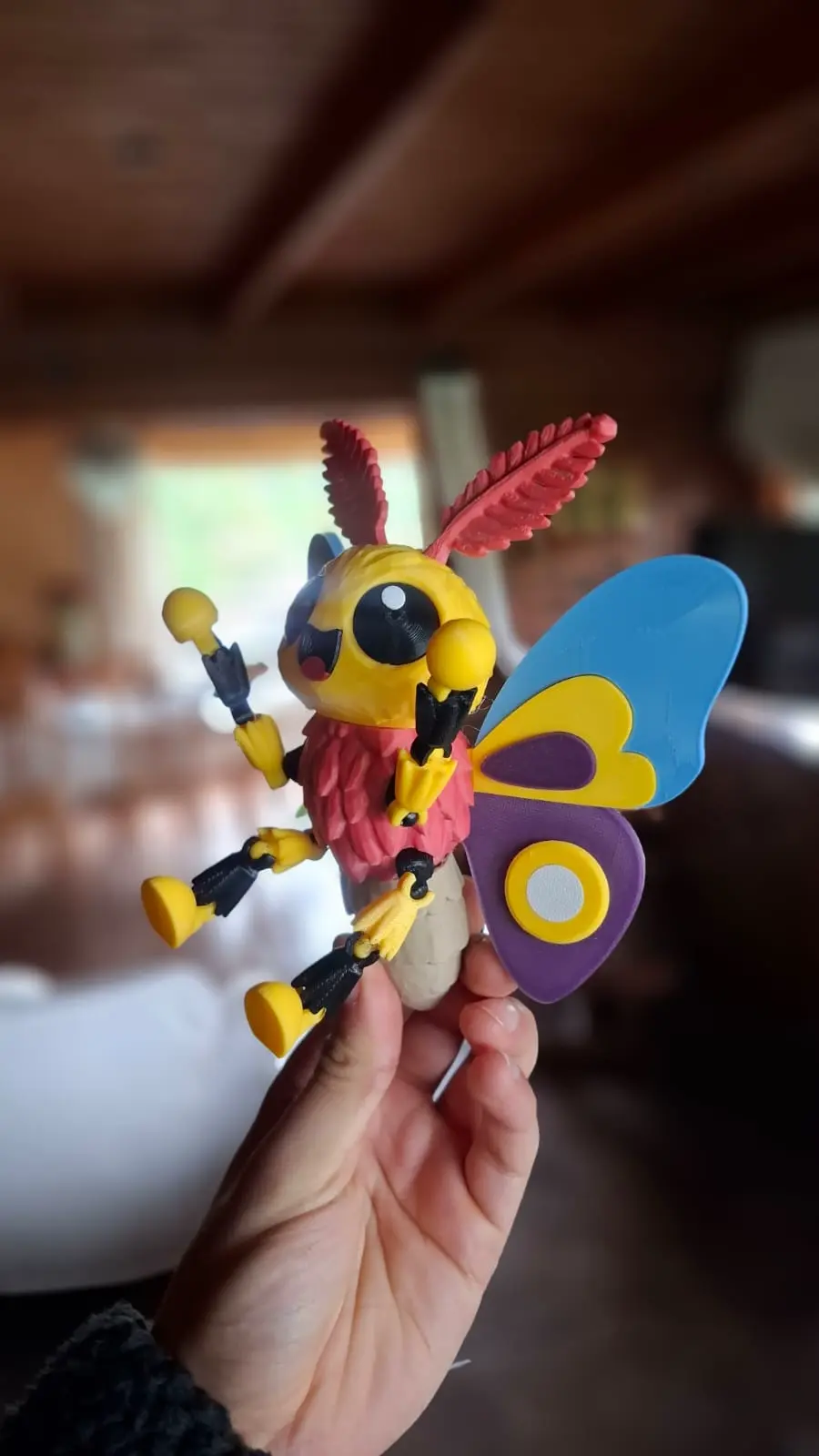 Articulated multicolored moth