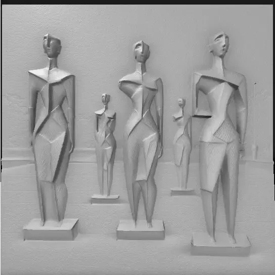 series of modern abstract statues in an open plaza,