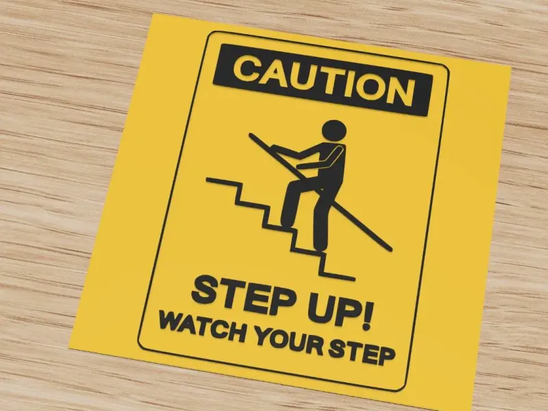 Caution sign: step up, watch your step