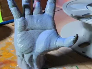 devil hand reaching out 