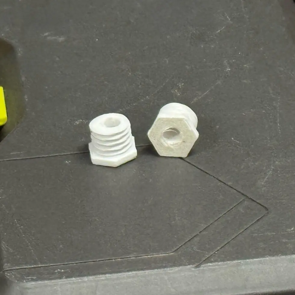 Connector with hole to allow filament guide tube through