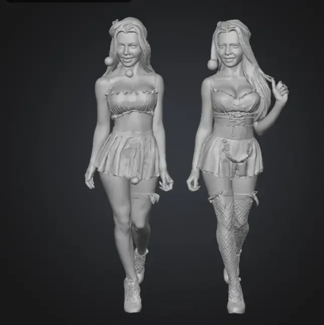 Twin girls in tiny Christmas dresses