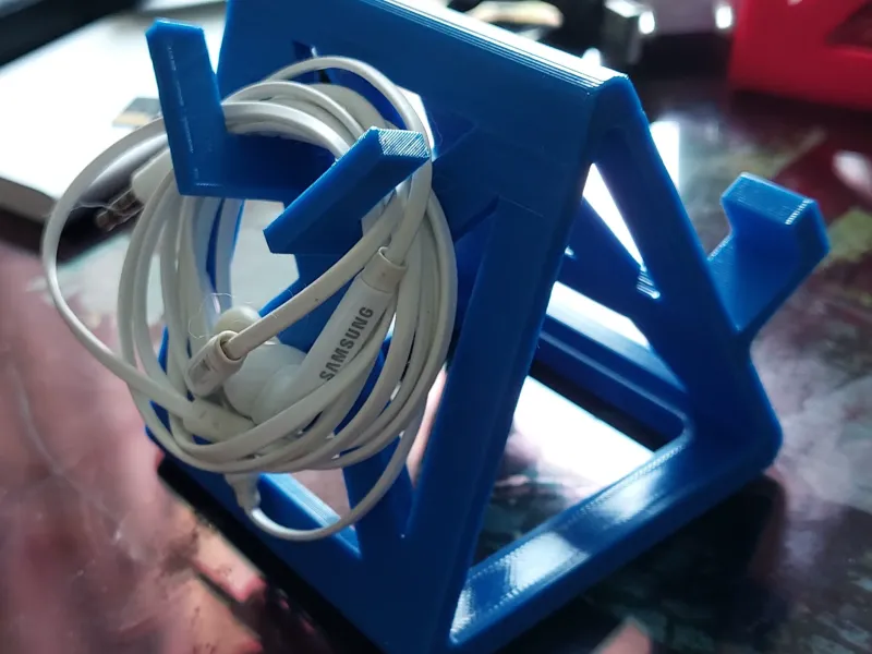 Phone stand with headphone hanger