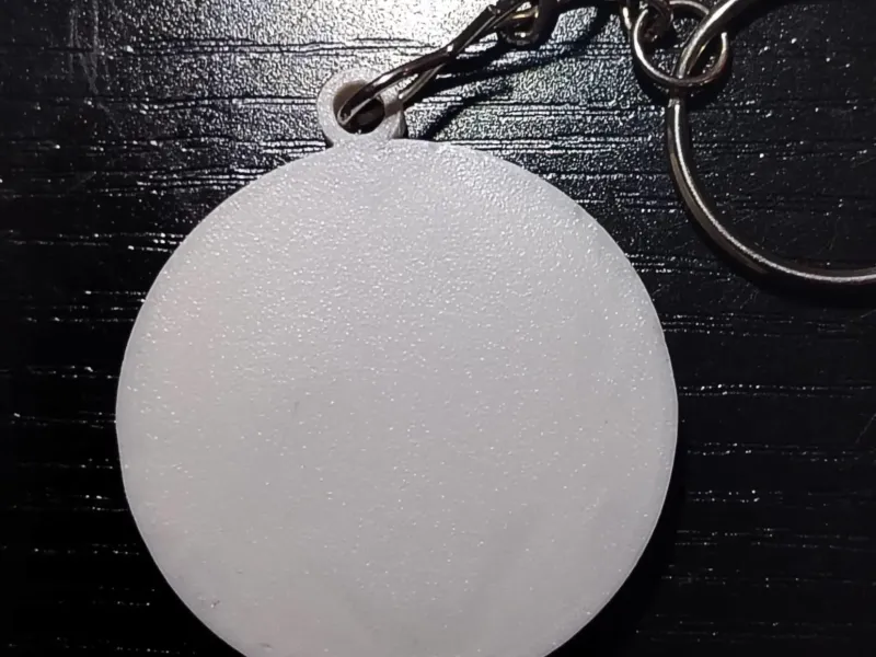 Flat round pocket whistle keychain