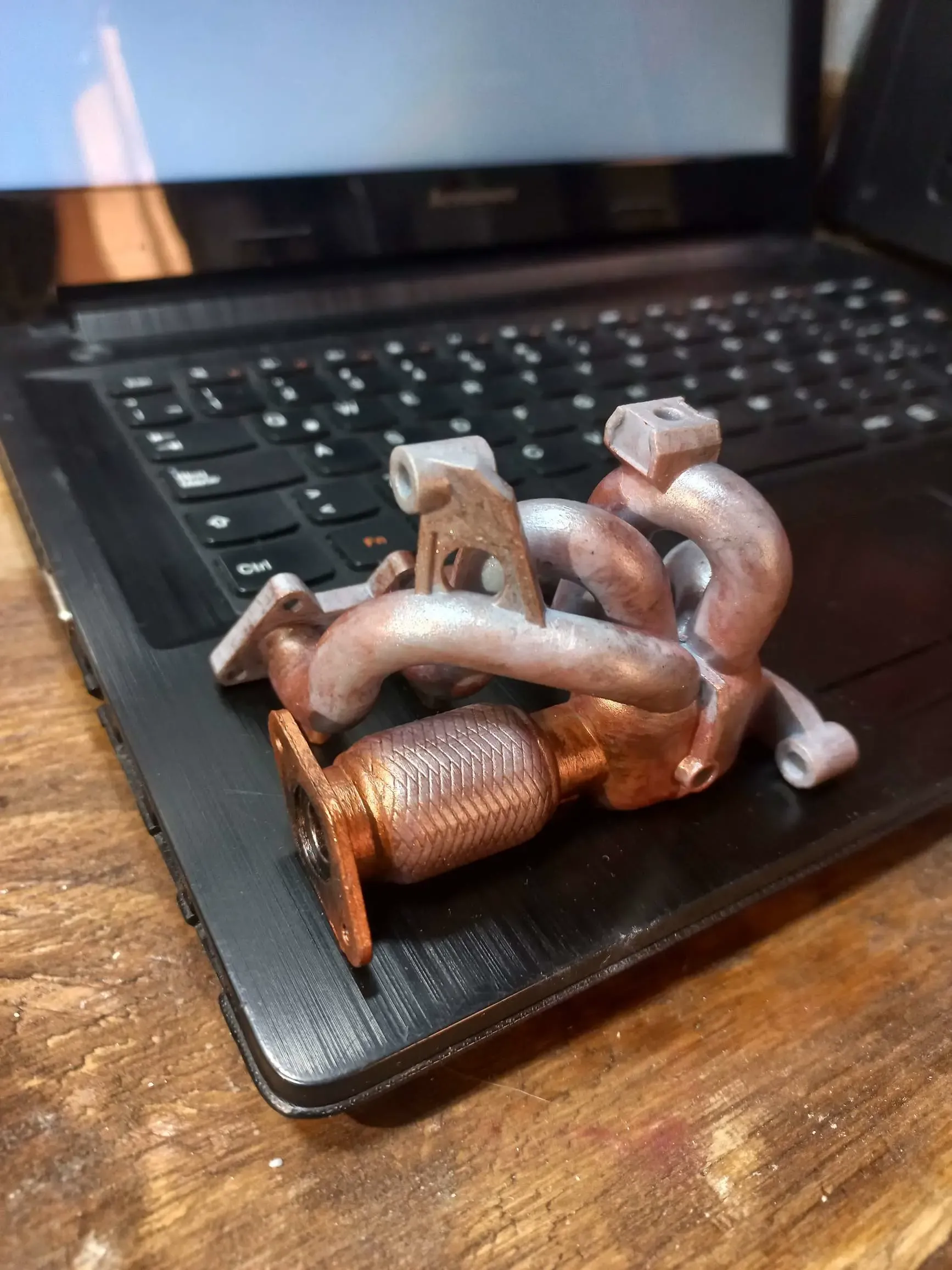 Phone stand- exhaust manifold