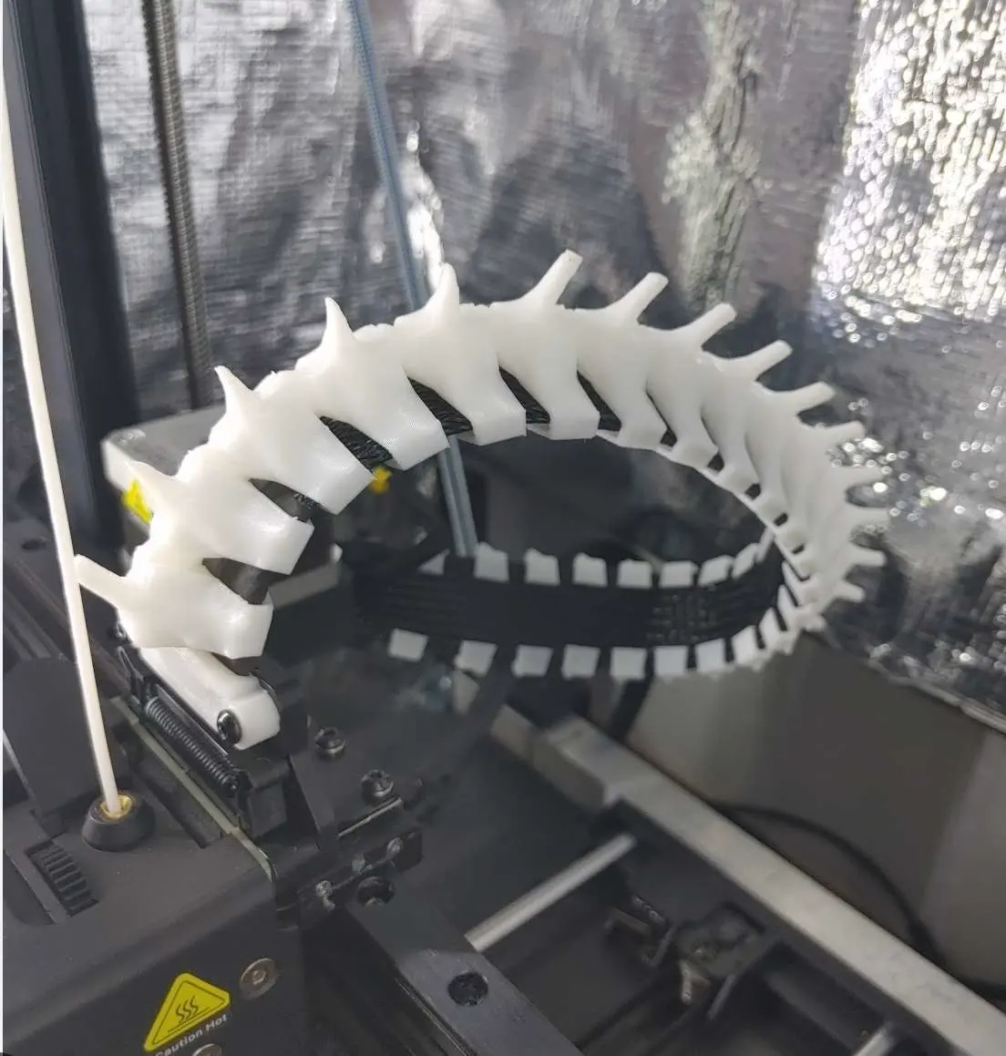 Hot end cable spine/spike chain