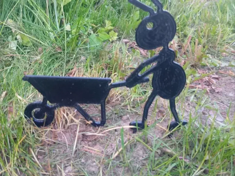 Garden figure of an ant with a wheelbarrow