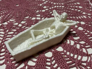 Skeleton in a coffin