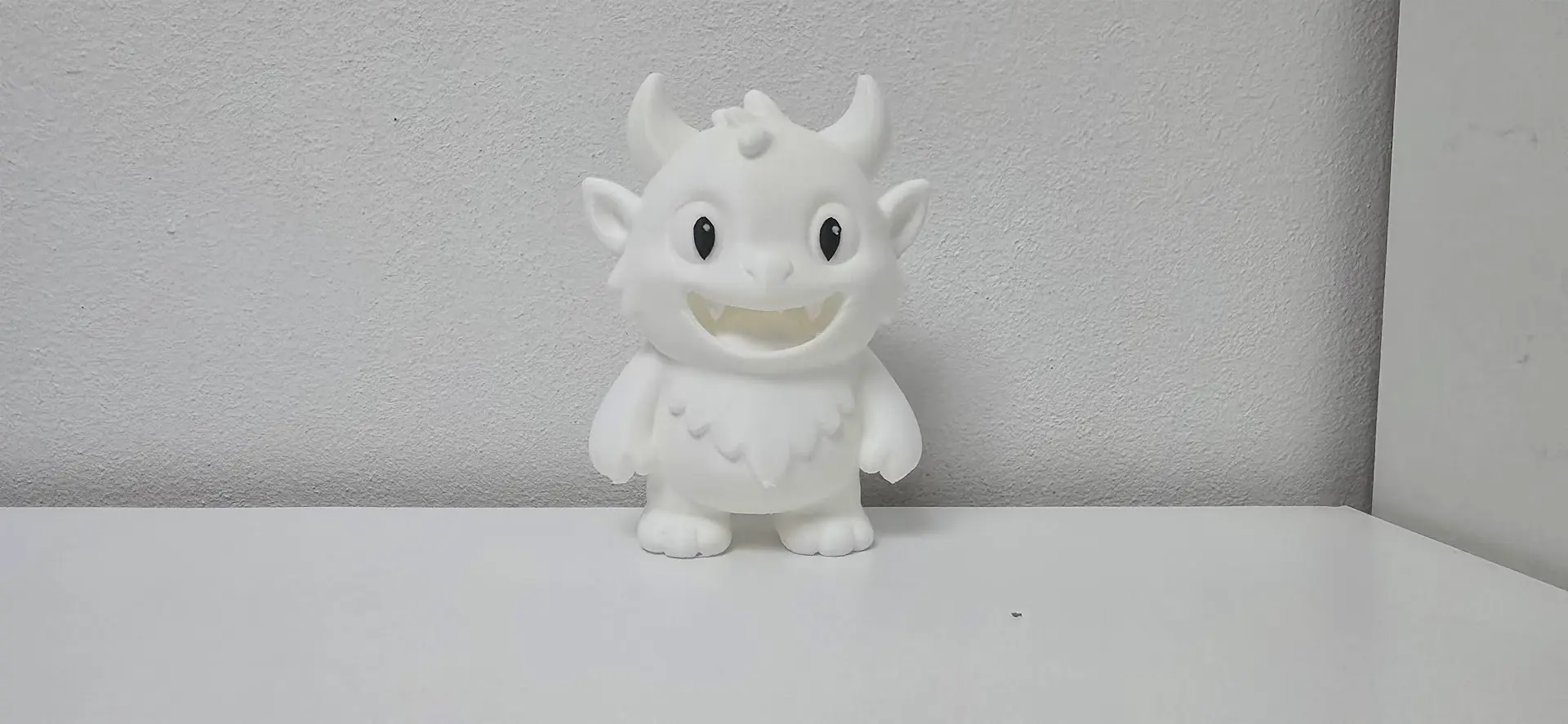 White Furry Horned Monster Wide Grin Toy
