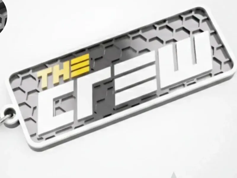 Der Crew-Logo-Schlüsselanhänger