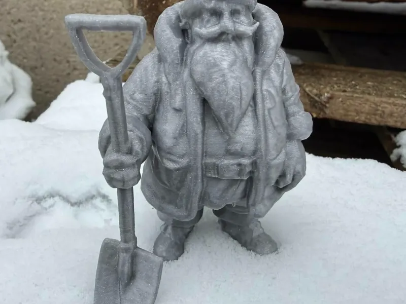 Santa Claus with a snow shovel
