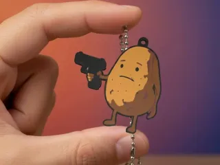 LLAVERO PAPA PISTOLERA