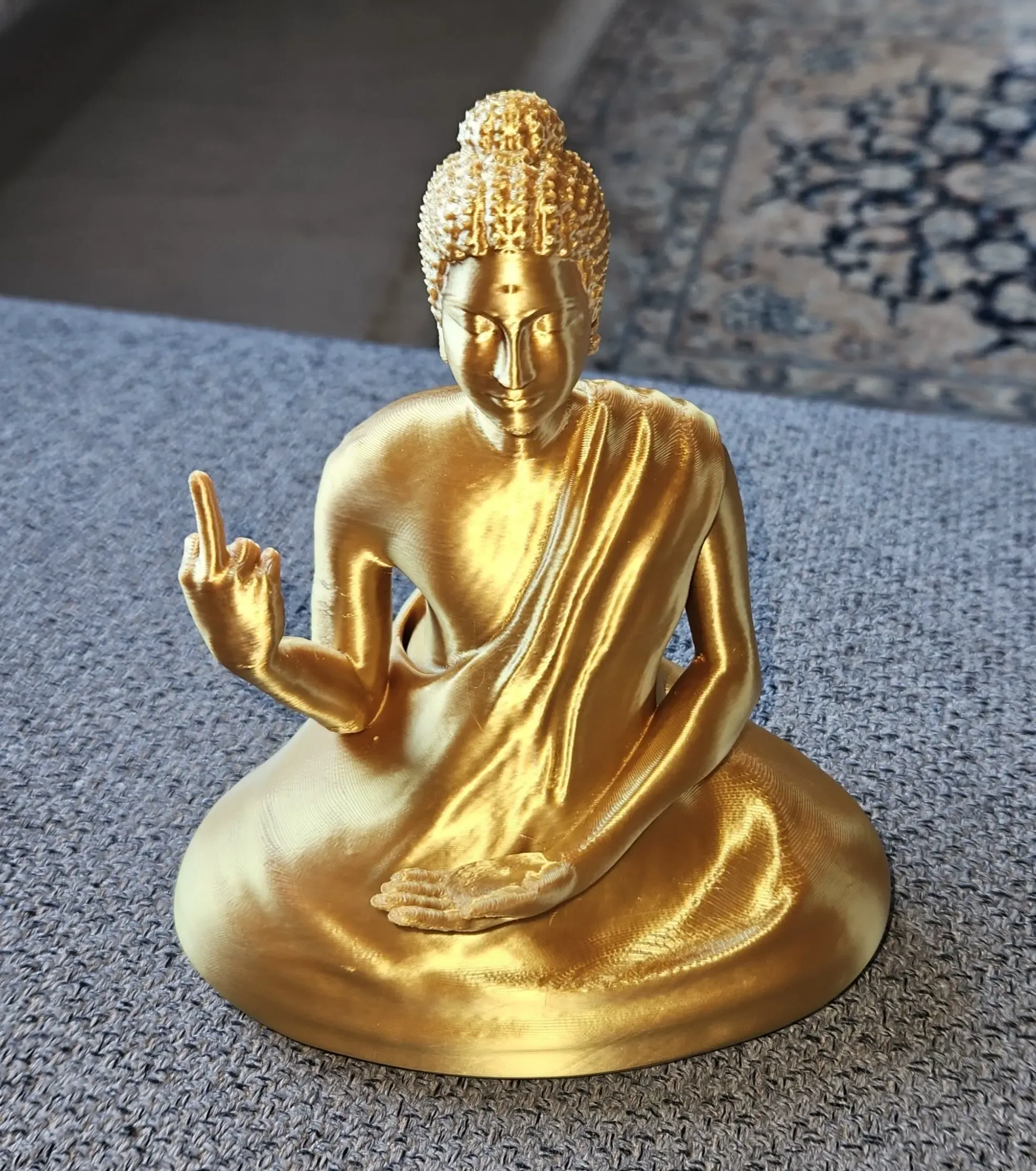 BUDDHA STATUE WITH MIDDLE FINGER
