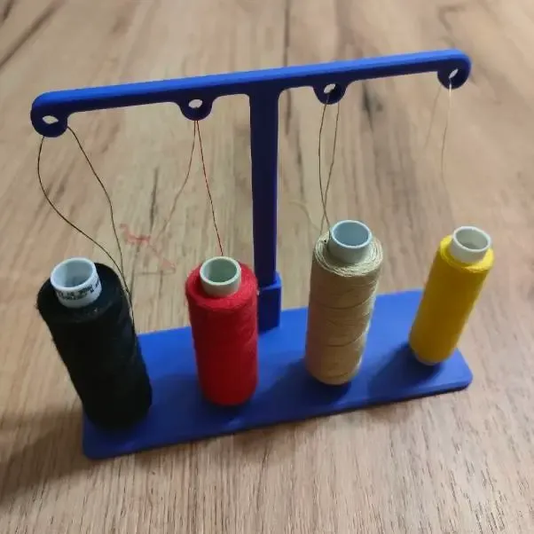 Thread guide for sewing machine for four spools
