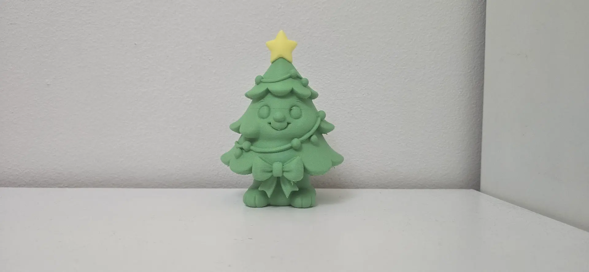 Smiling Tree with Star and Bow Christmas Figure