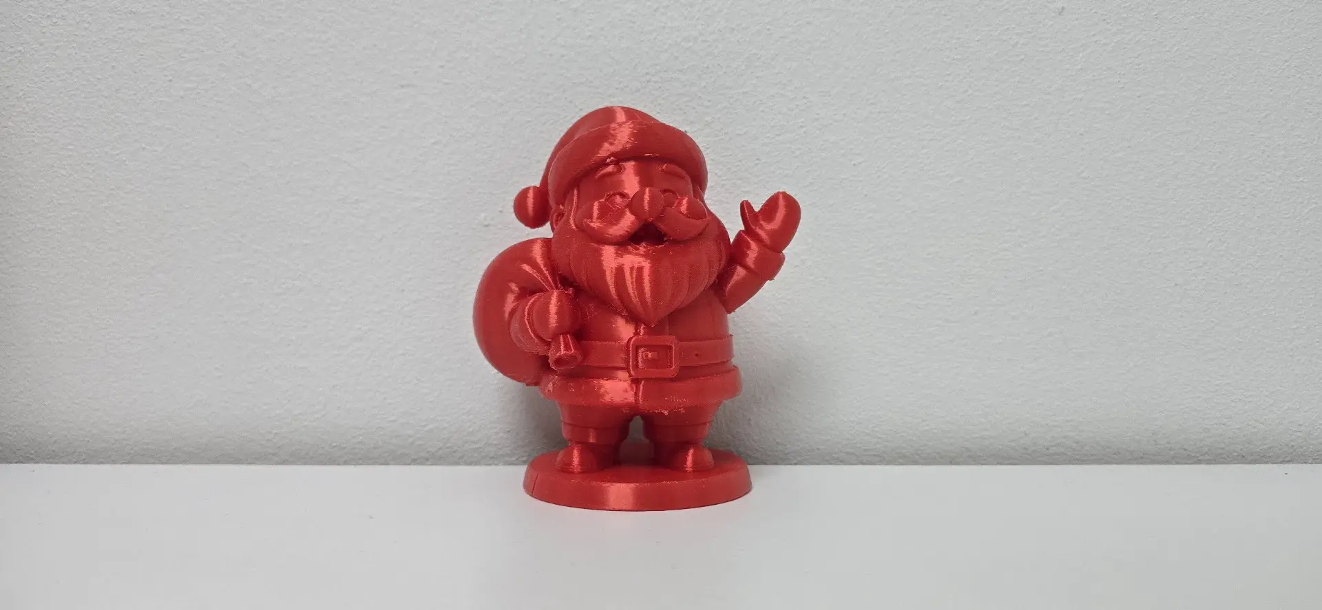 Jolly Santa Claus Waving with Gift Sack Christmas Figurine