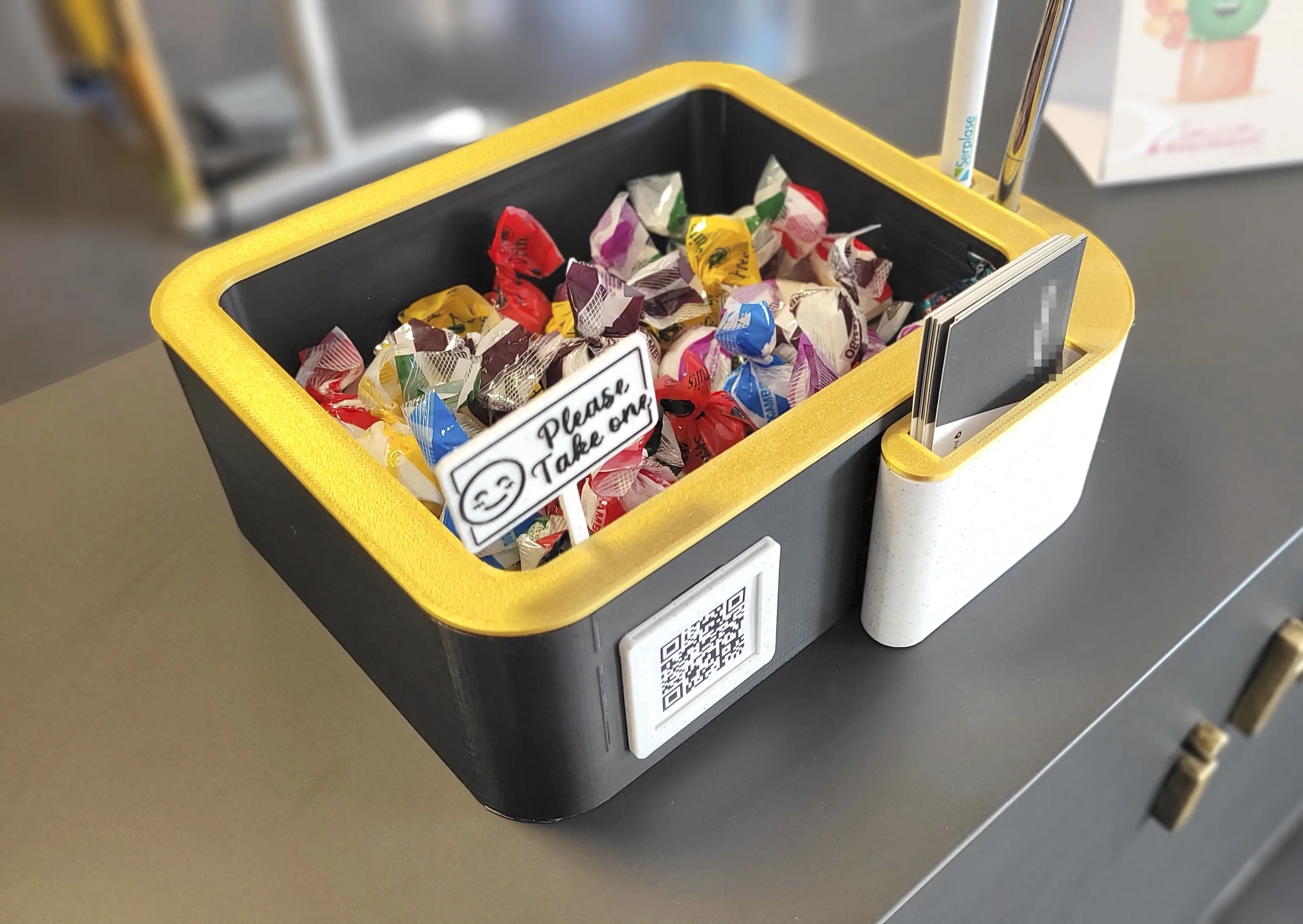 Card & pen holder with candy bowl and greeting sign.
