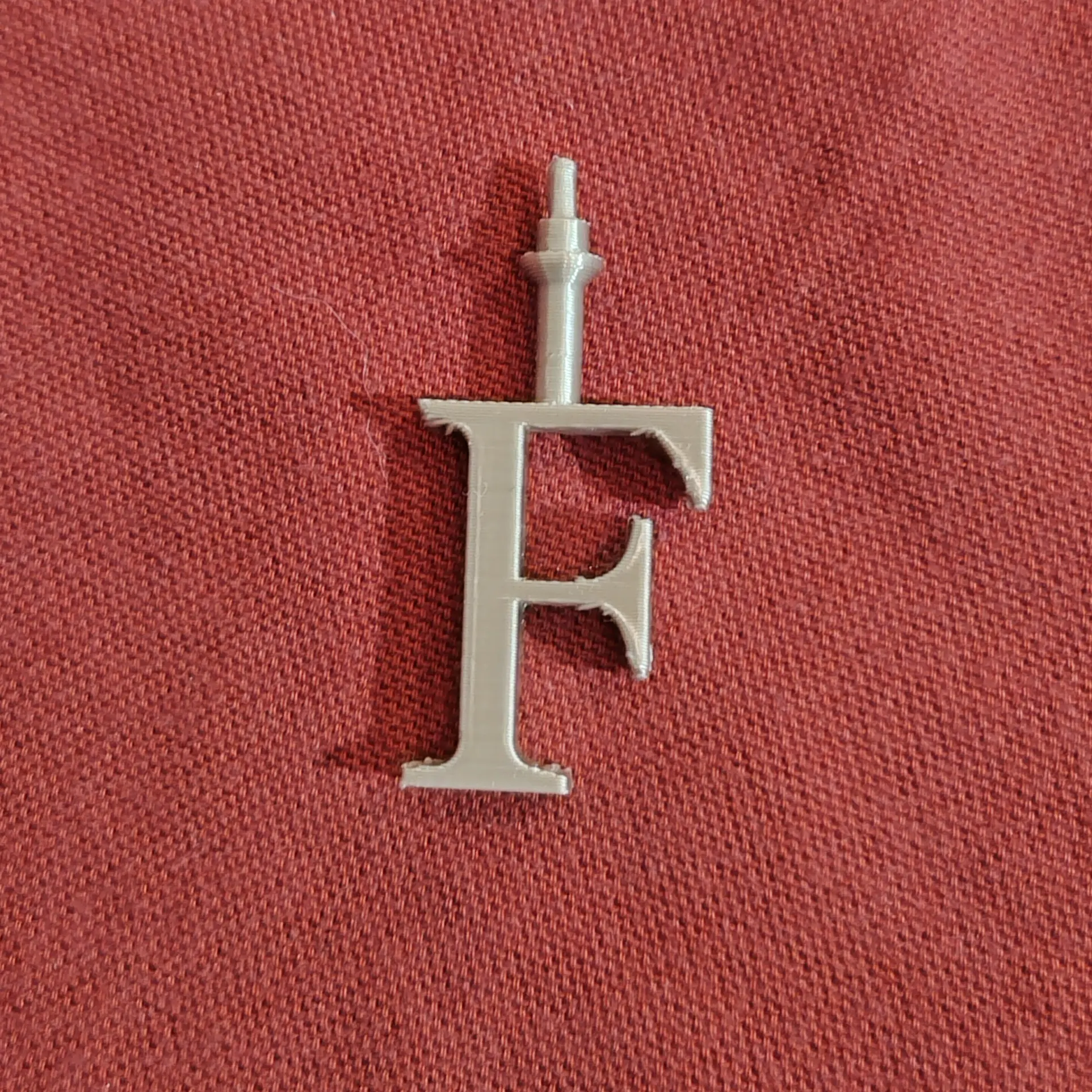 Christmas ball, letter F