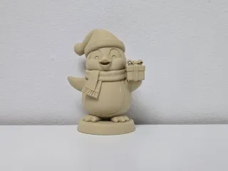 Smiling Penguin with Santa Hat and Gift Christmas Figurine