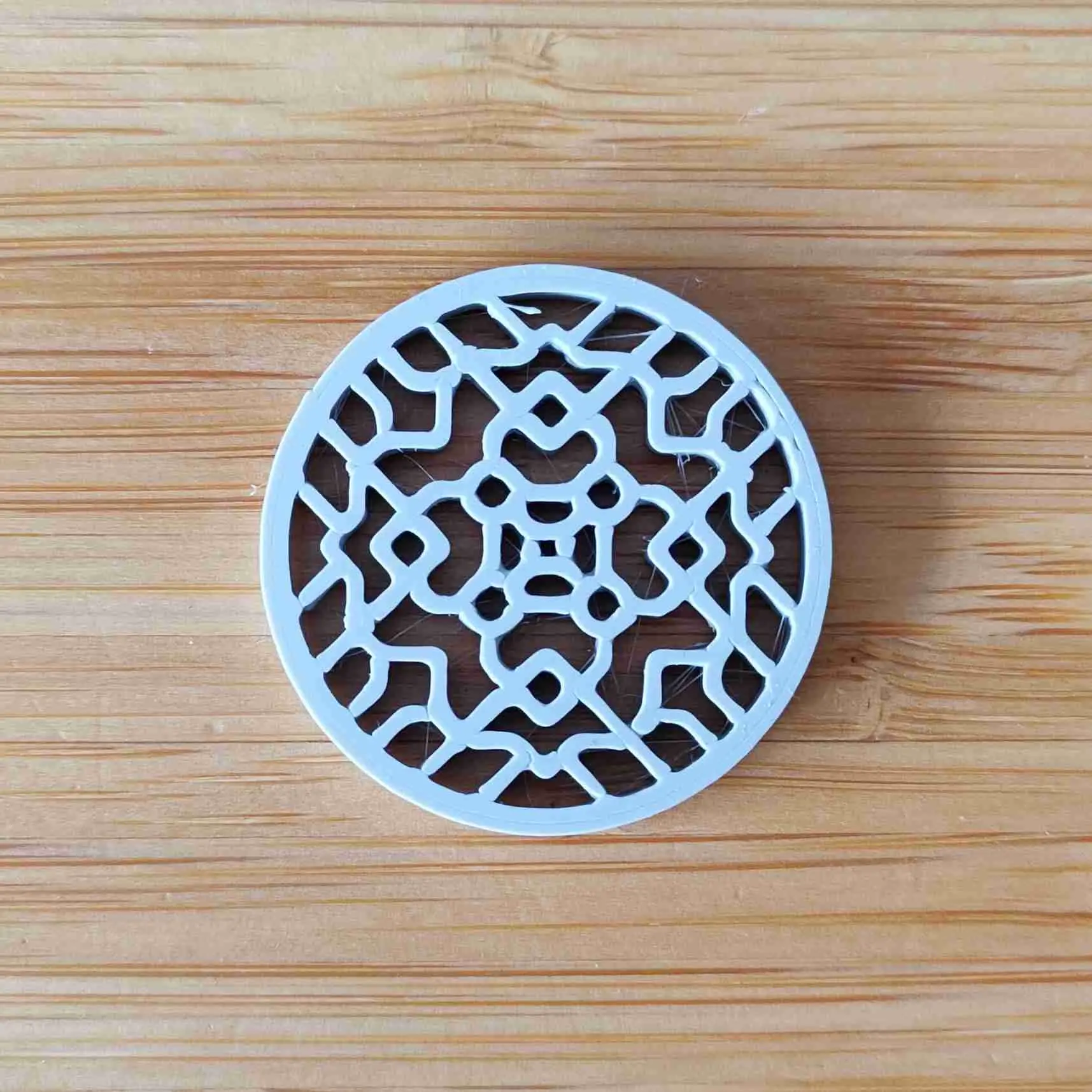 Ornamental shirt or blouse button - geometrical ornament