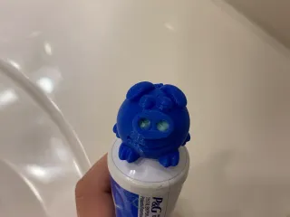 Toothpaste topper pig and plug