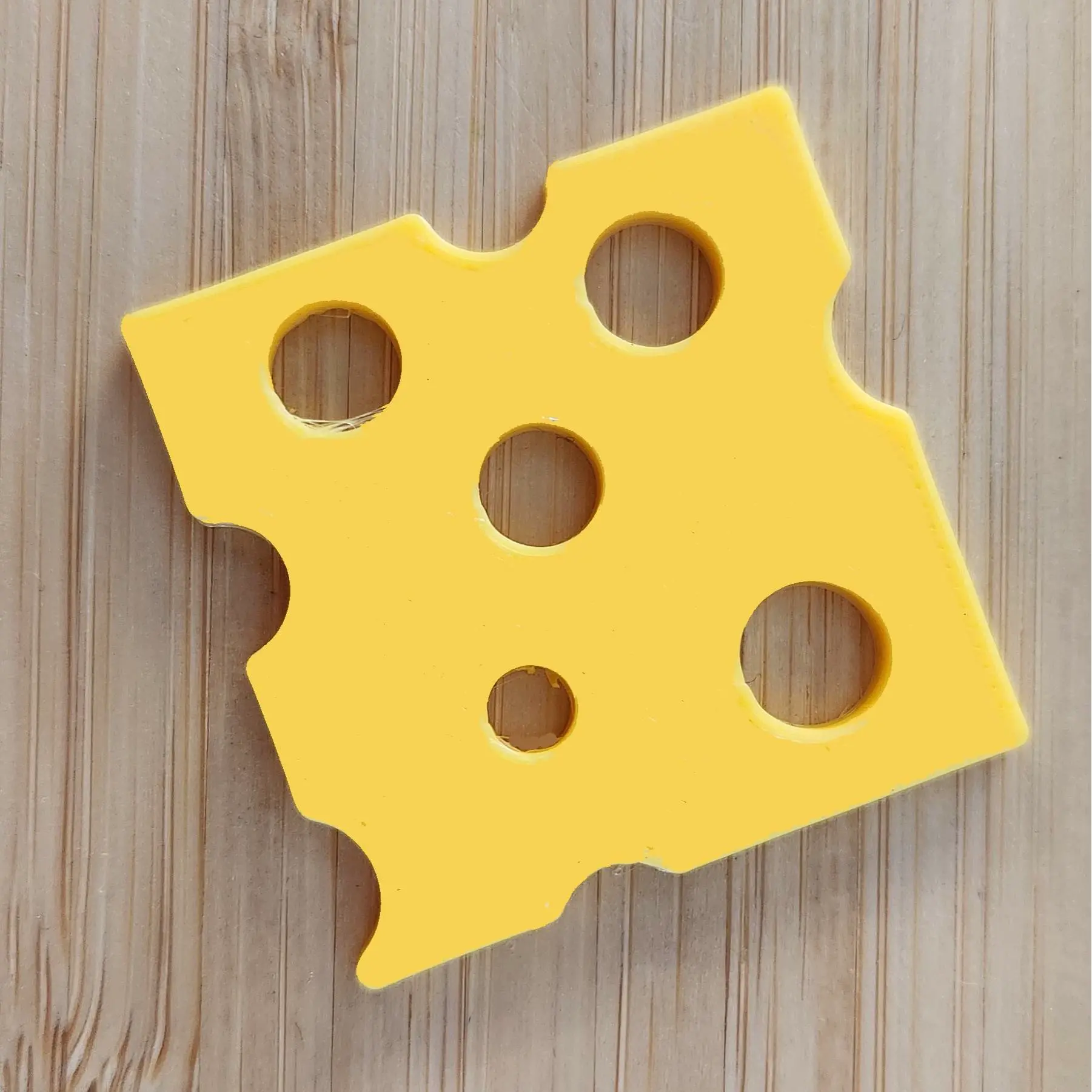 Slice of cheese for sensory or imaginative play