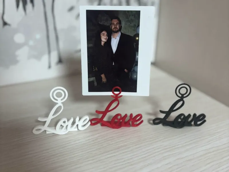 Instant photo holder frame saying love