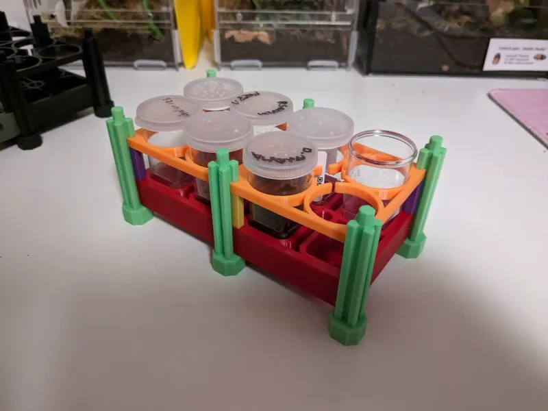 freely expandable and stackable rack system for sling vials
