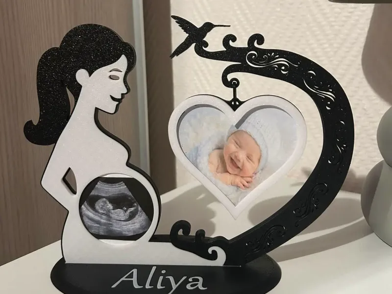 silhouette of pregnant woman with ultrasound and photo of ba