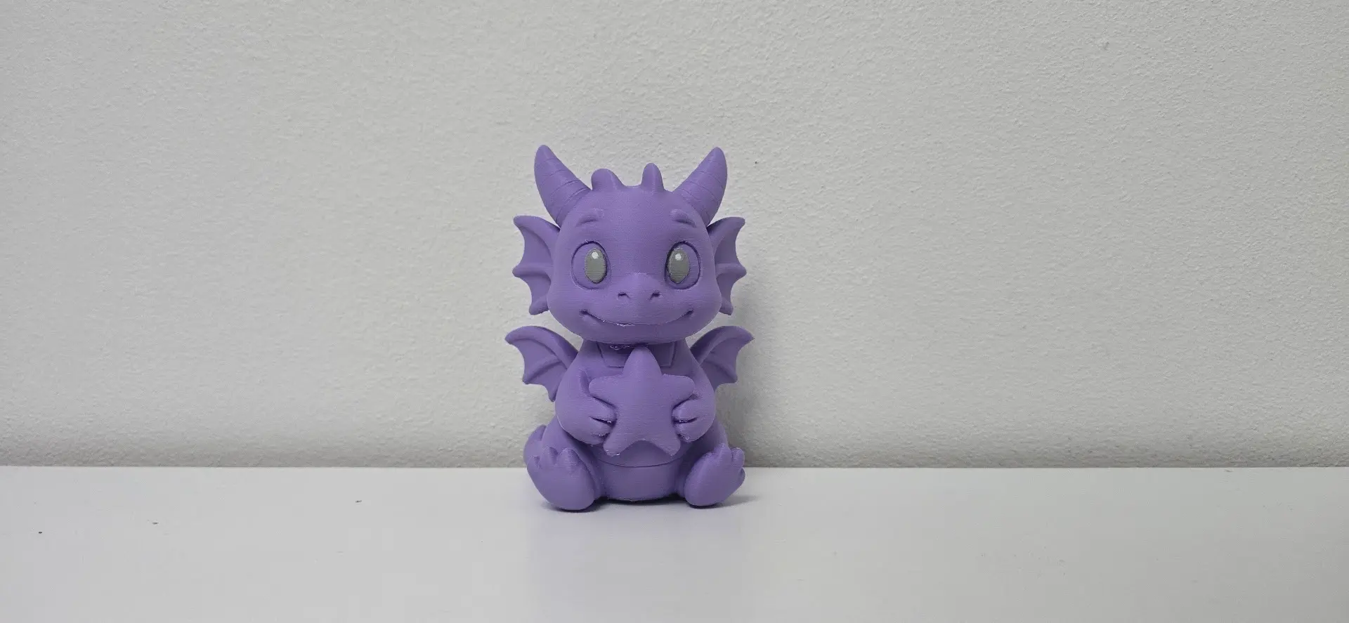 Baby Dragon with Star Christmas Figurine