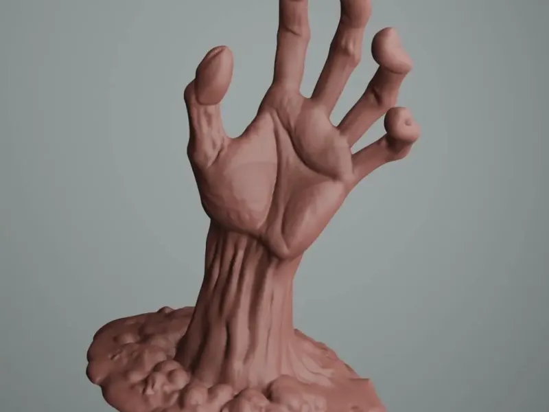 Halloween zombie hand rising from the dirt