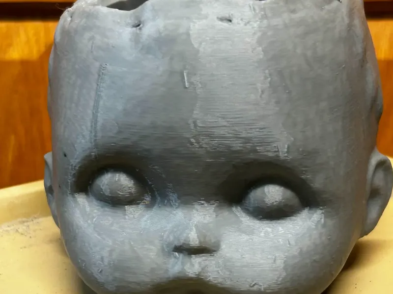 Baby doll head pot