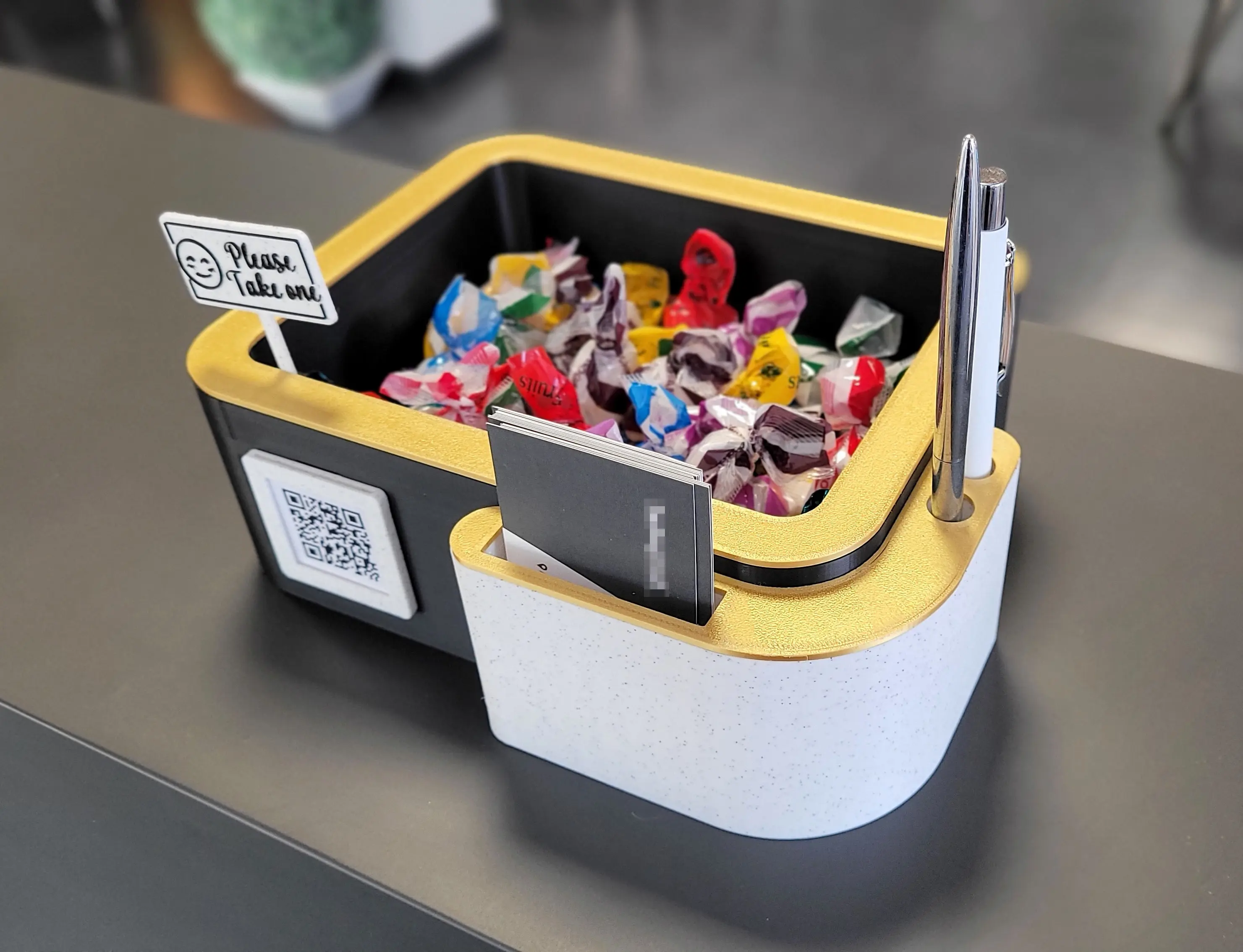 Card & pen holder with candy bowl and greeting sign.