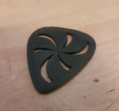 Pick with swirly pattern for guitar or bass