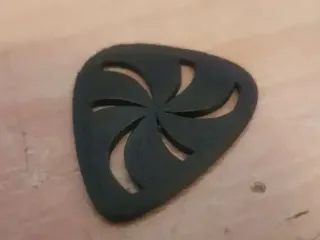 Pick with swirly pattern for guitar or bass