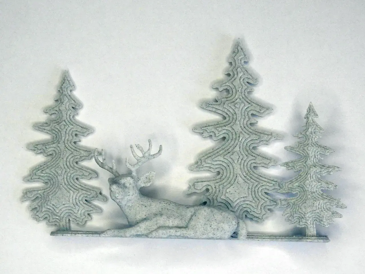 Sleepy deer with trees