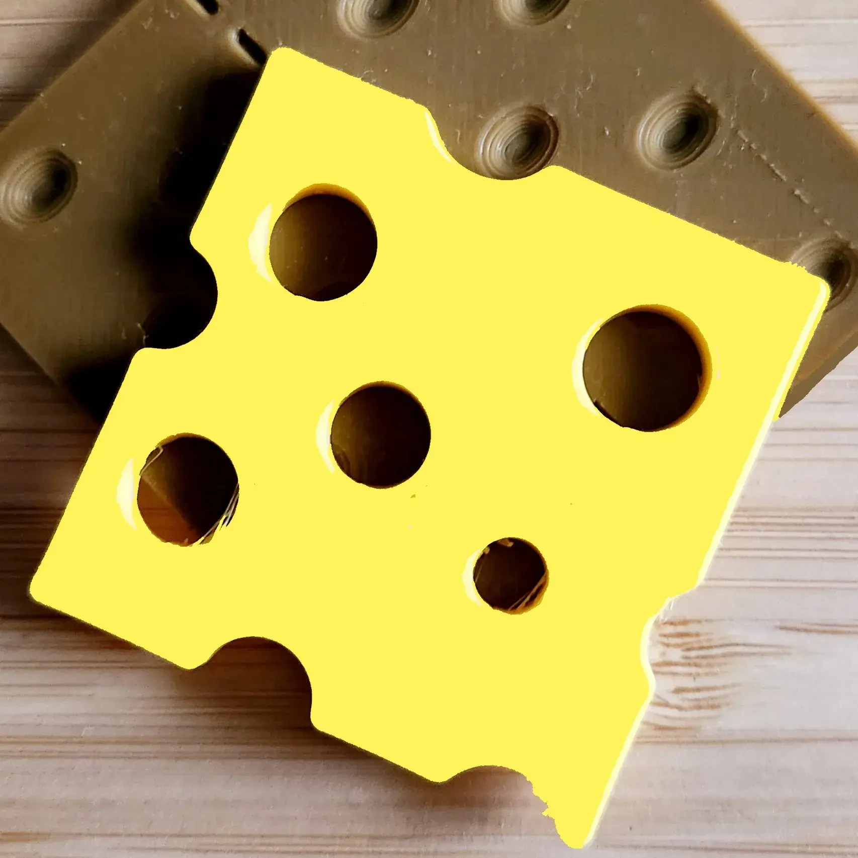 Slice of cheese for sensory or imaginative play
