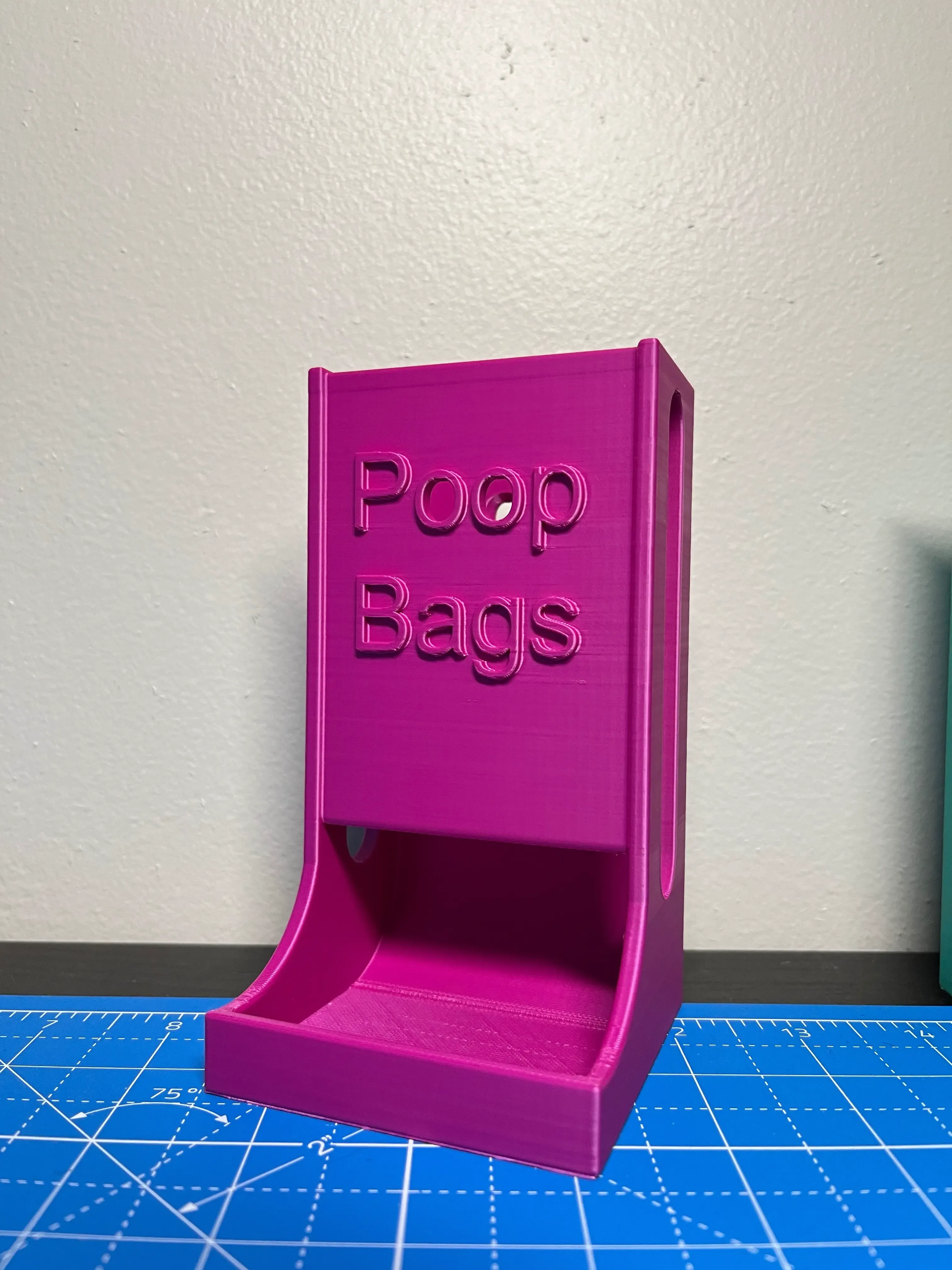 Poop bag roll dispenser