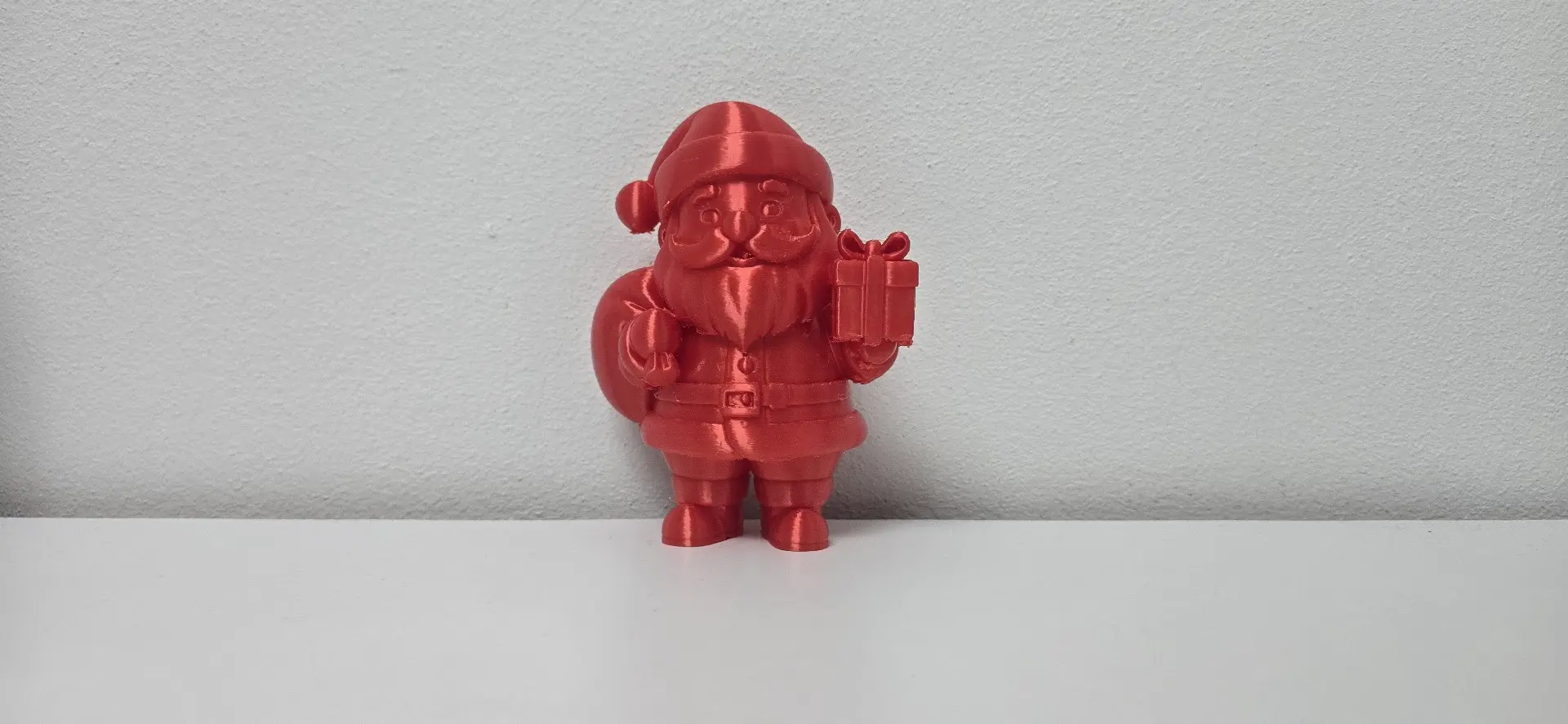 Jolly Santa Claus with Gift and Sack Christmas Figurine