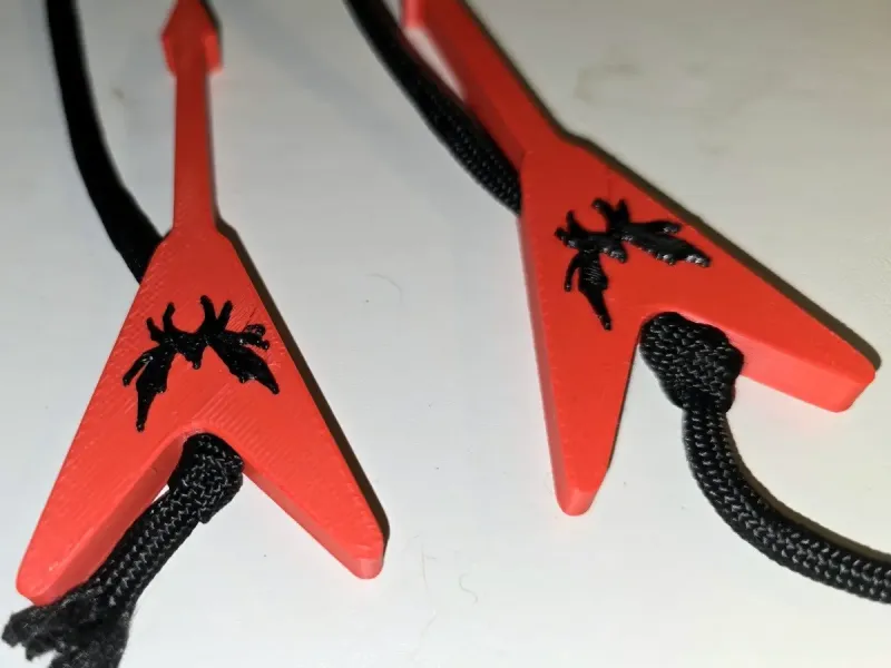 Flying V Guitar Hoodie Bead with Dematus's band logo.