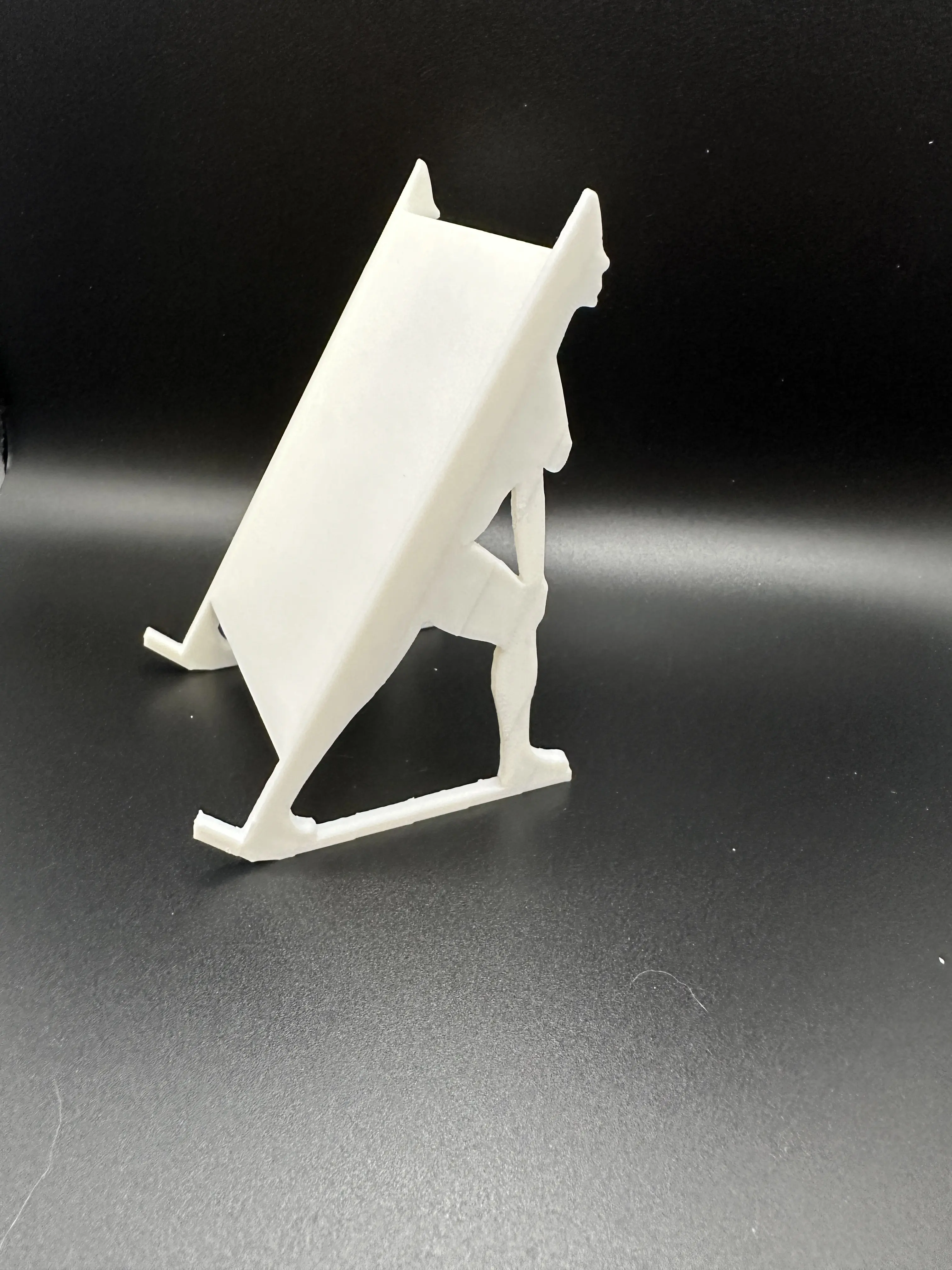 Woman silhouette book/phone holder.
