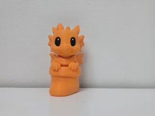 Baby Dragon in Christmas Stocking Figurine