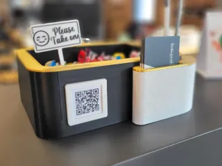 Card & pen holder with candy bowl and greeting sign.