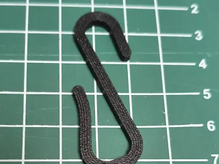Hook to attach decorations to HPL panels