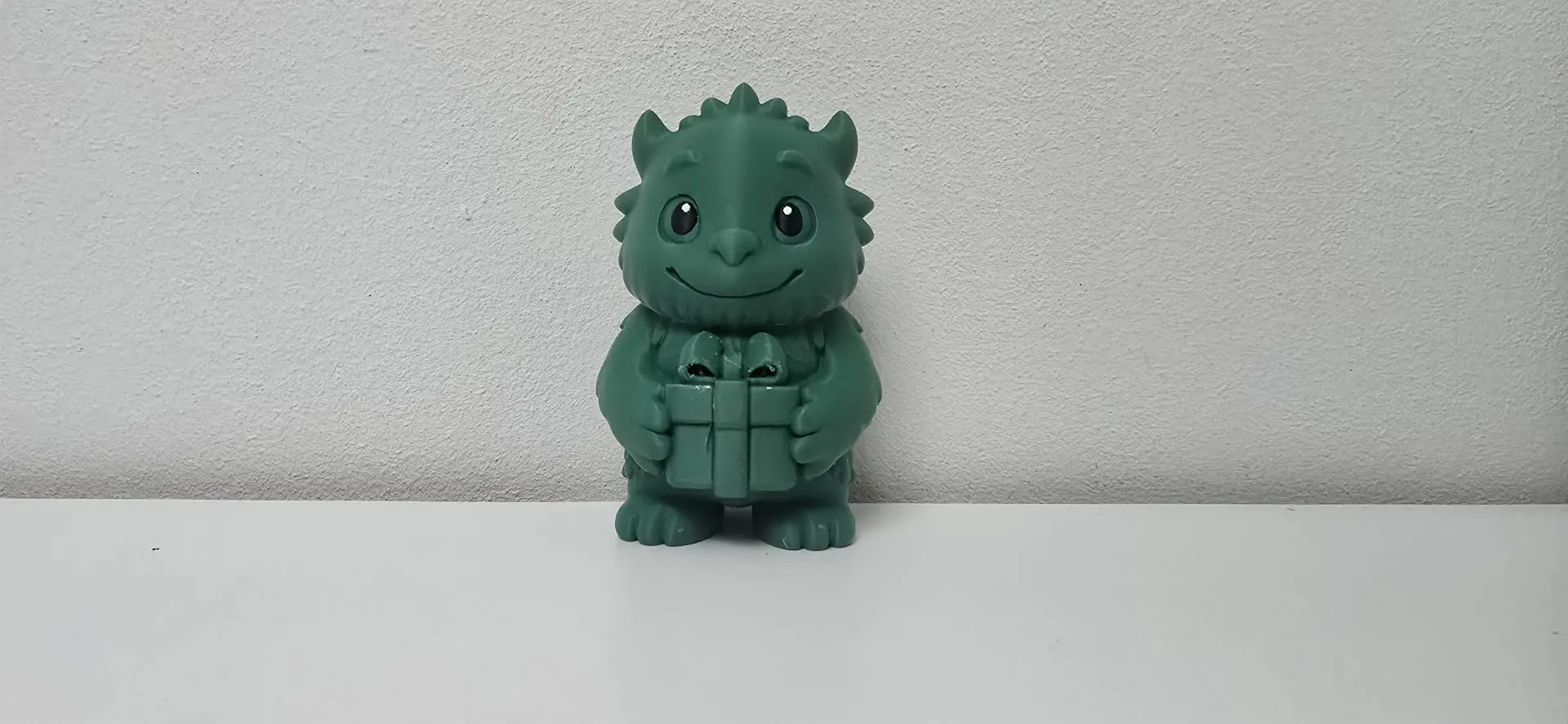 Monster with Gift Box Christmas Figurine