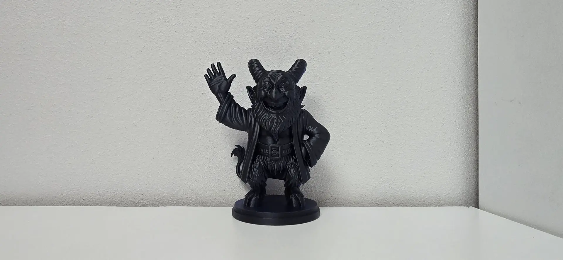 Waving Cloaked Demon Holiday Figurine