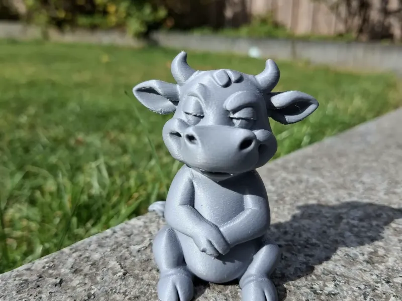 Mischievous Cow Figurine