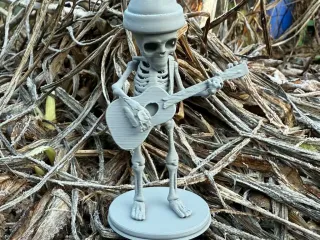 Winter skeleton with guitar on stand